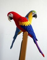 scarlet and blue and gold crocheted parrots.jpg